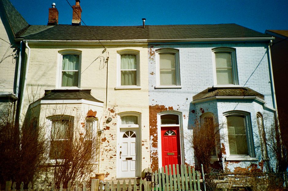 Painted exterior wall of a home in sunlight