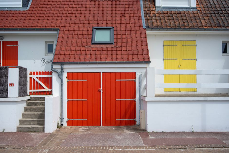Colored painted walls on a house under a clear sky