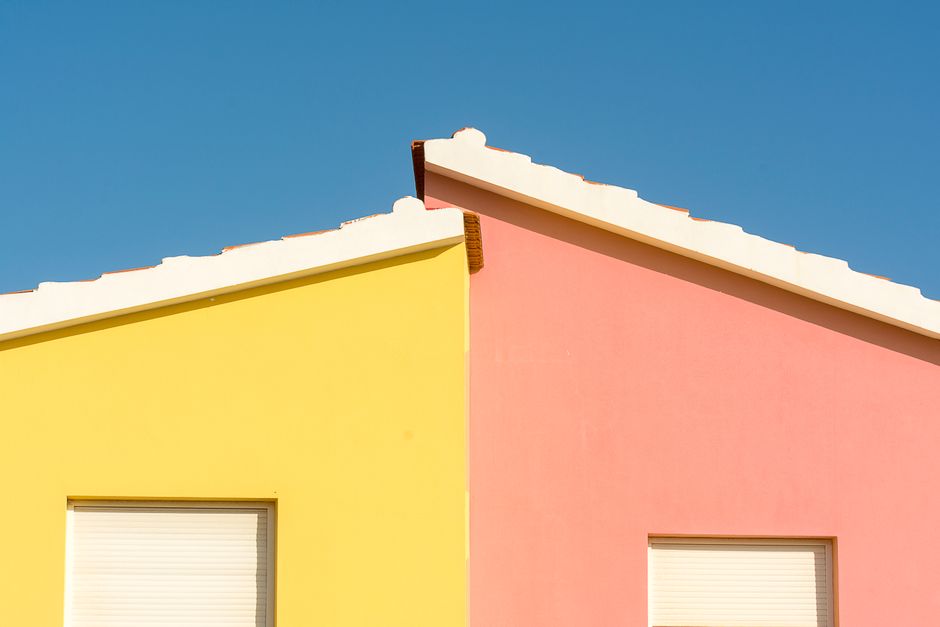 Colored painted walls on a house under a clear sky