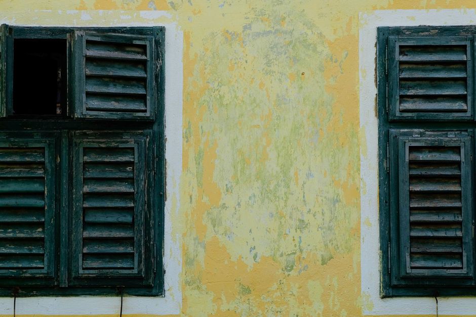 Colored painted walls on a house under a clear sky